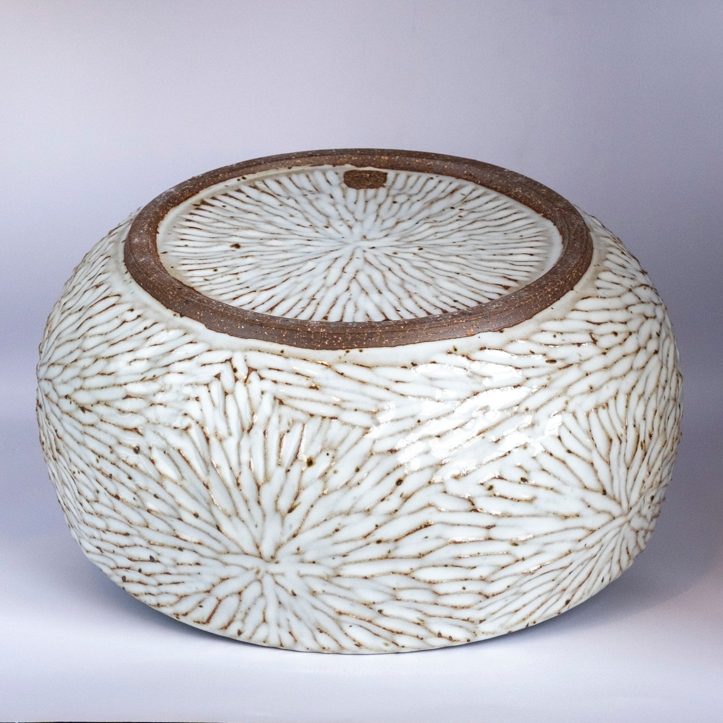 hand carved, brown stoneware bowl, white speckled glaze